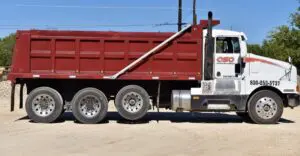 A red and white dump truck
